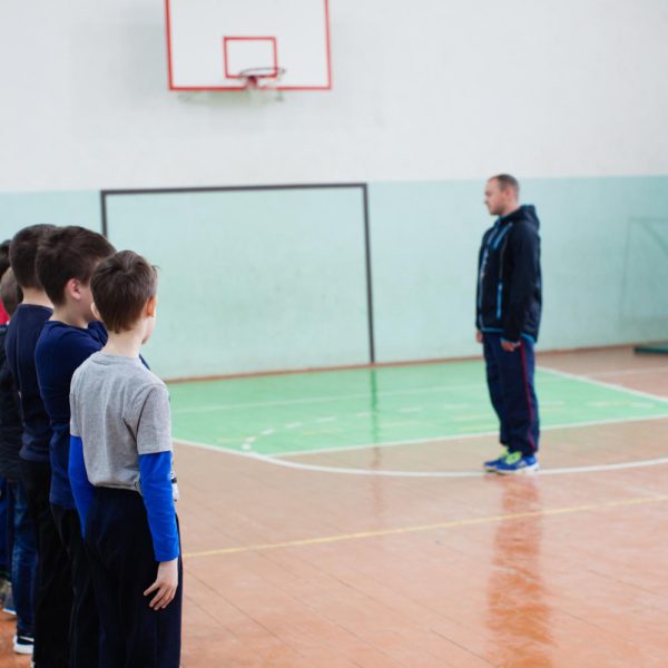 children-physical-class-stand-rank-front-teacher