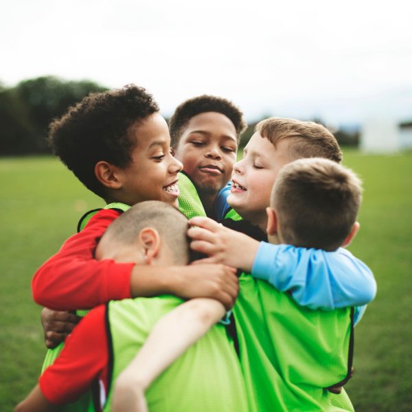 junior-football-team-hugging-each-other